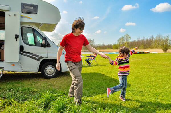 family with caravan at holiday park