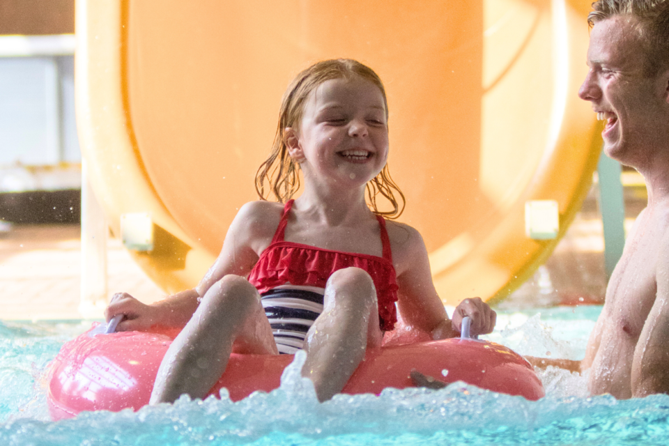 Girl enjoying the slide at Lady's Mile indoor pool