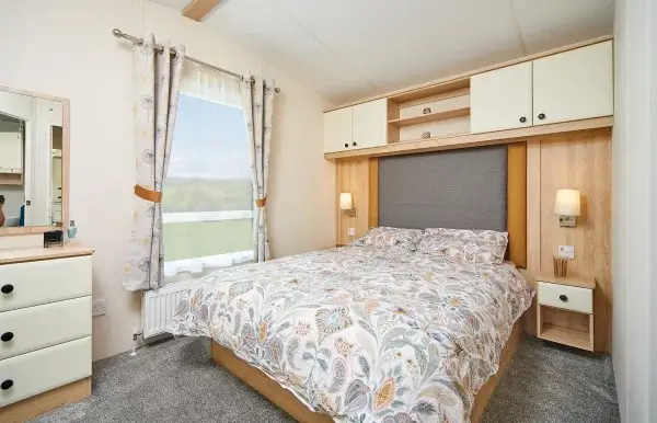 A double bedroom with overhead storage