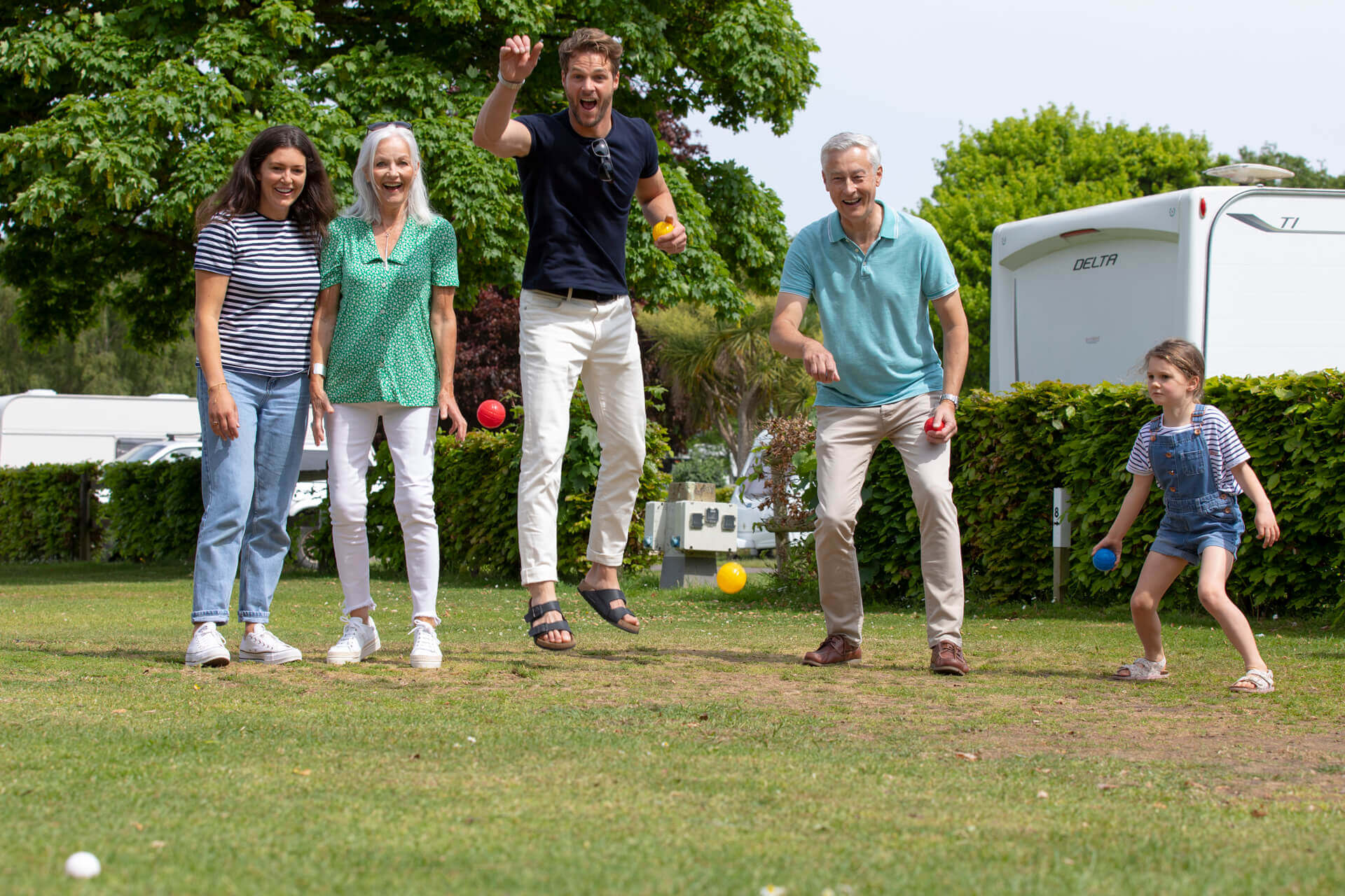 Cheering family playing boules