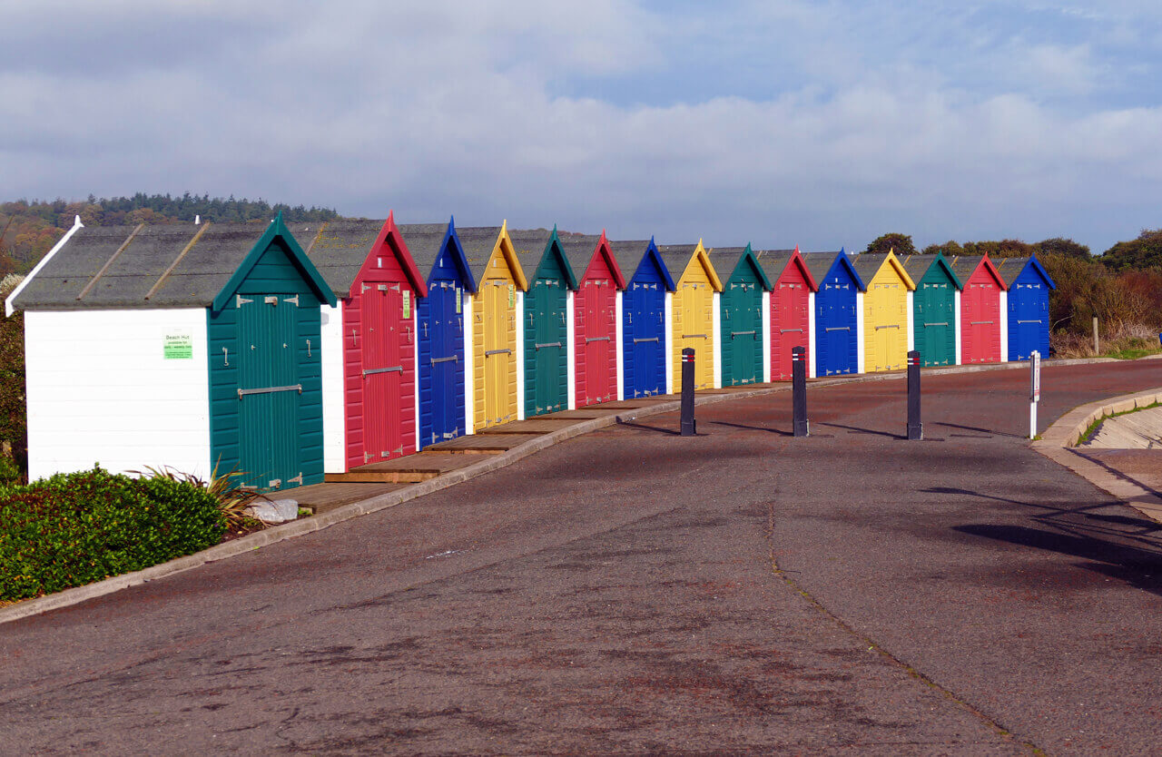 Colourful beach huts at Dawlish Warren